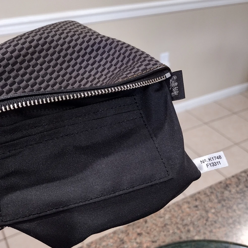 Black and gray checkered Coach Wristlet